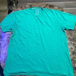 Rocky the cat laying on my Starter tee-shirt